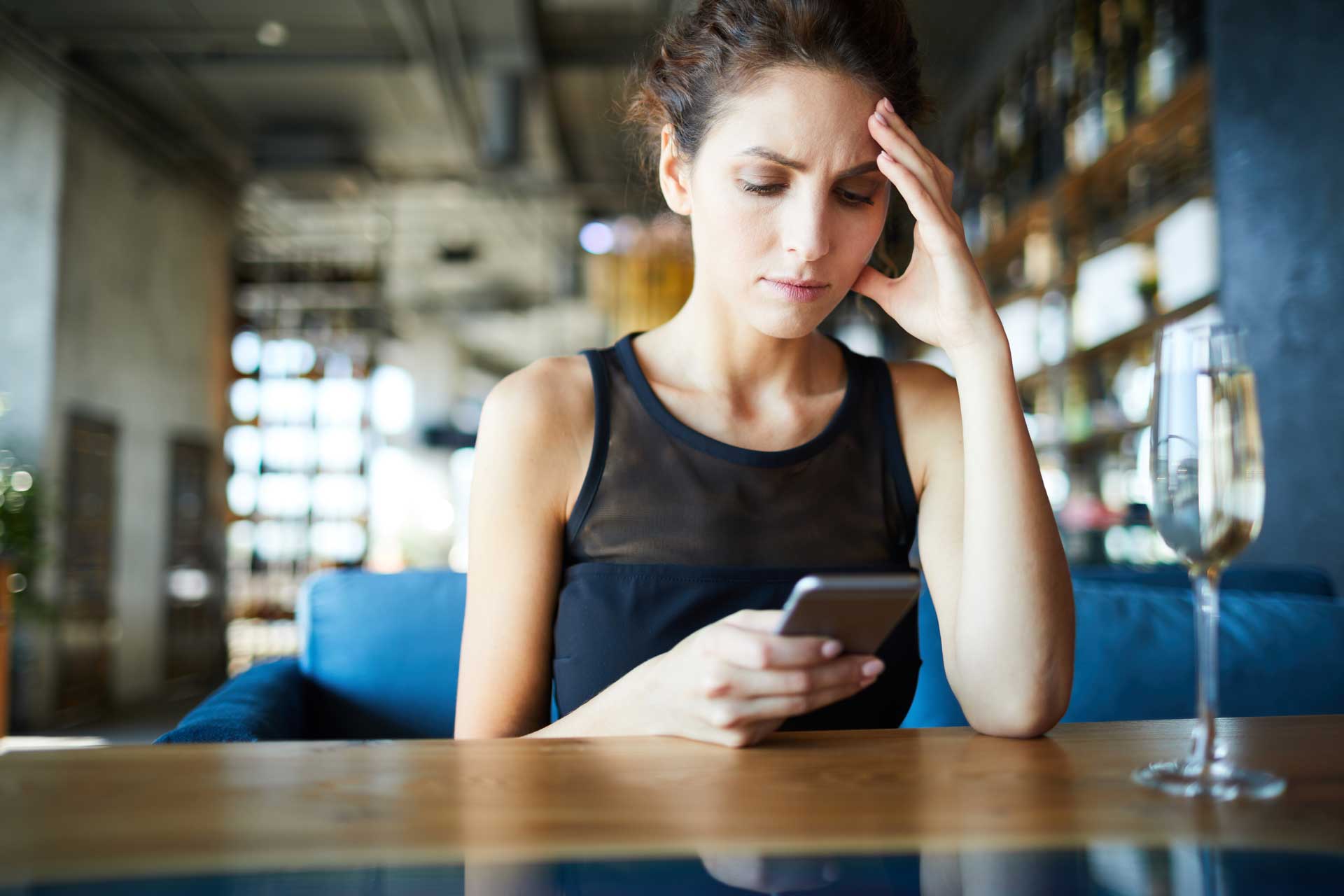 Person watching political news coverage looking stressed